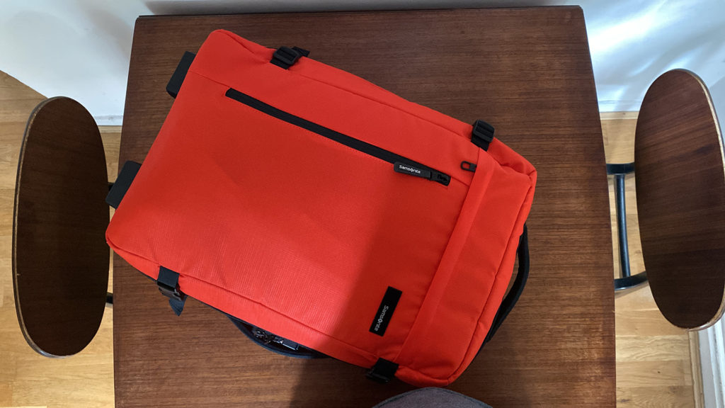 A small carry-on duffel bag with wheels.